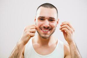 A man who takes care of his teeth photo