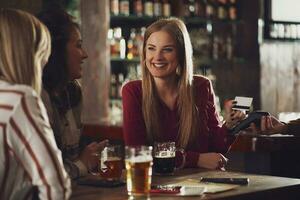 Friends having fun at the bar photo