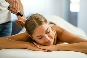 Woman enjoying a back massage photo