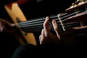 Playing an acoustic guitar photo