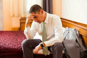 A businessman in a hotel room photo