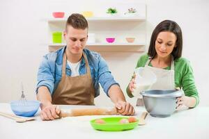 A couple cooking together photo