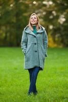 A happy woman in the park photo