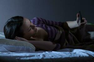 A young woman resting in the bed photo