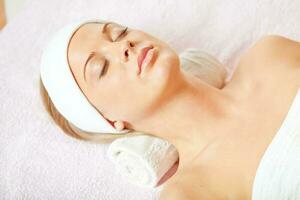 A woman having a facial treatment photo