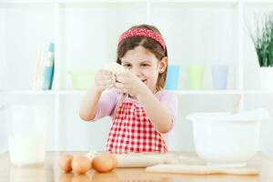 A young girl cooking photo