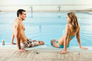 Couple at the swimming pool photo