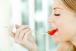 Woman promoting healthy eating habits photo