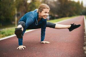 A young woman doing physical exercises photo