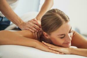 Woman enjoying a back massage photo