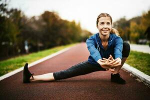 A young woman doing physical exercises photo