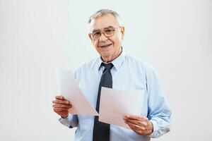 Portrait of a senior businessman with papers photo