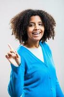 Portrait of Afro woman with a blue cardigan photo