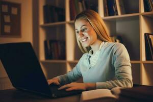 Tired college girl studying late night at home photo