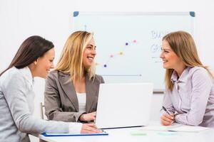 Businesswomen discussing business plan photo