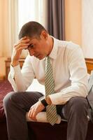 A businessman in a hotel room photo