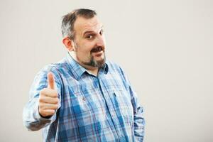 Portrait of a man with blue plaid shirt photo