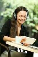 A woman hanging out at a coffee shop photo