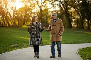 A senior couple spending time together in the park photo