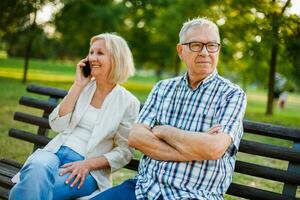 A senior couple spending time together in the park photo