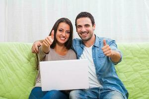 Portrait of a young couple with a blank board photo