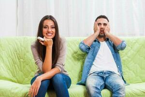 Portrait of a young couple arguing photo