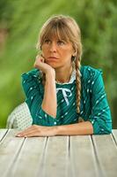 A bored woman at the table photo