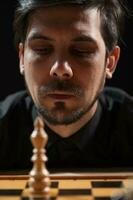 A man playing chess photo