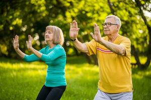 A senior couple doing physical exercises photo