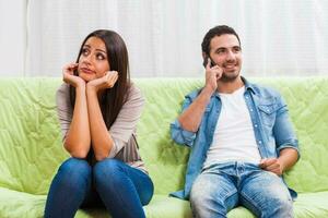 Portrait of a young couple arguing photo