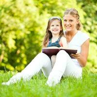 A mother and a daughter spending time outdoors photo