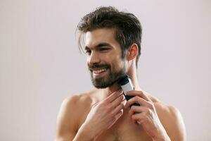 A man grooming his beard photo