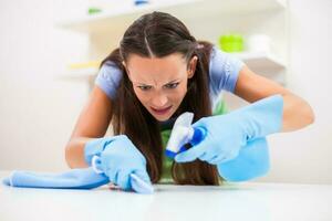 A woman cleaning the house photo