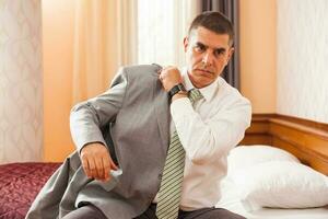 A businessman in a hotel room photo