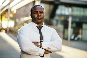 Portrait of a serious Afro businessman photo