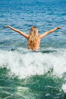 Woman standing in the sea photo