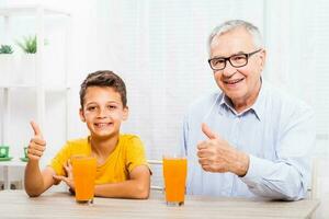 A grandfather spending time with his grandson photo