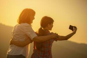 Grandmother and granddaughter spending time outdoors photo