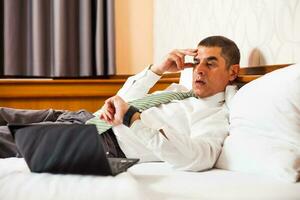 A businessman in a hotel room photo
