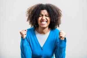 Portrait of stressed Afro woman with a blue cardigan photo