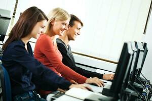 Students learning in a computer lab photo