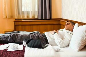 A businessman in a hotel room photo