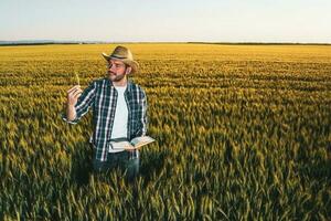 A farmer examining the crop photo