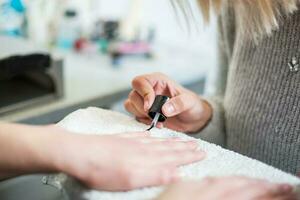 A woman at a manicure salon photo