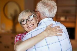 A senior couple hugging photo