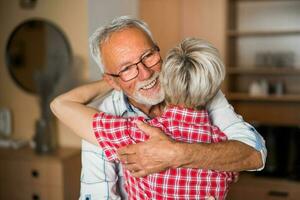 A senior couple hugging photo