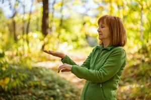 A senior woman doing physical exercises photo