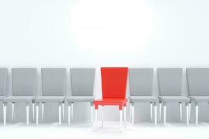 One red chair between white chairs. A row of chairs on a white background. photo