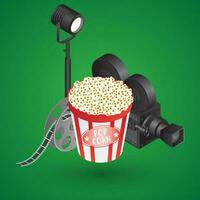 3D studio light with video camera, film reel and popcorn bucket on green background. vector