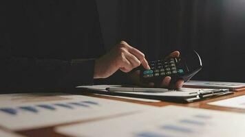 Investors are calculating on calculator investment costs and holding cash notes in hand. video